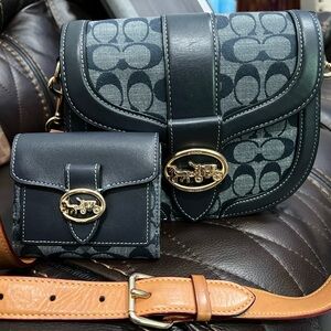 Coach - Navy saddle crossbody bag with matching wallet.